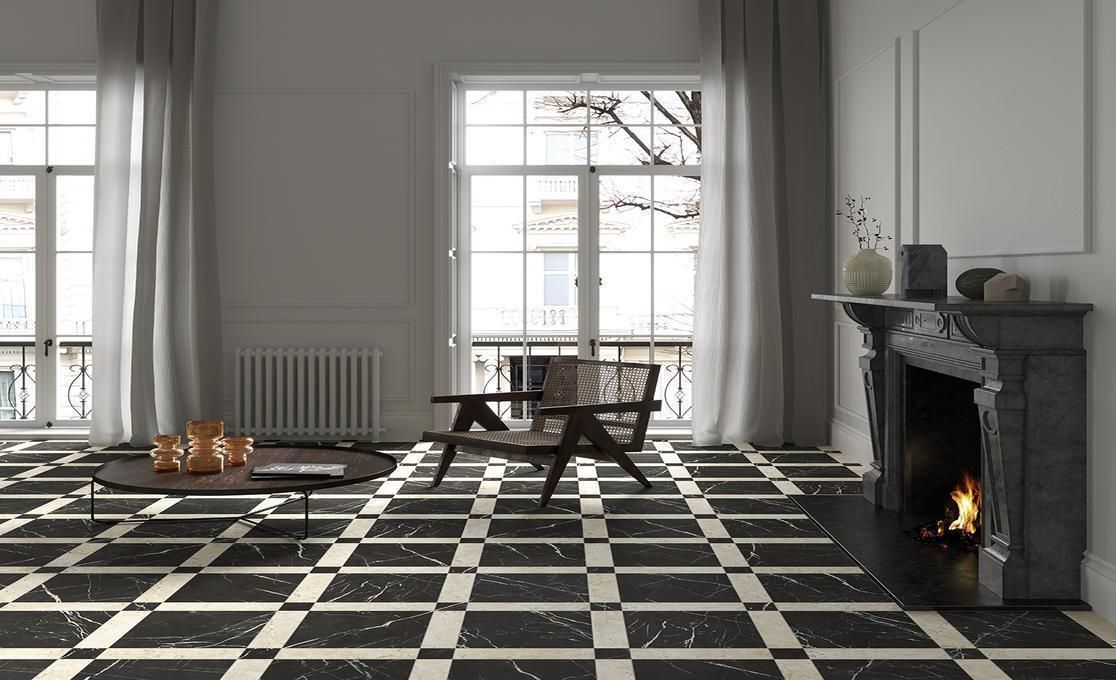 Elegant living room with black and white checkerboard marble-effect floor from the Marmorea collection.