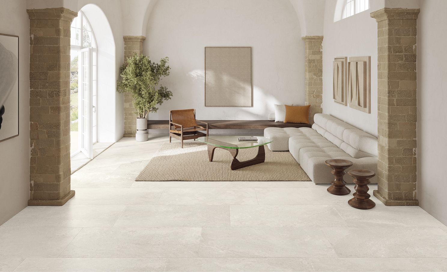 Light stone-effect porcelain flooring in a bright open-plan living space in Ireland